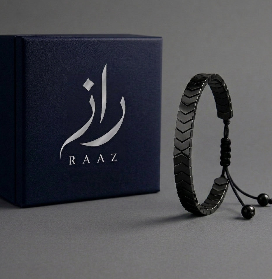 Black bracelet with RAAZ branding on a grey background