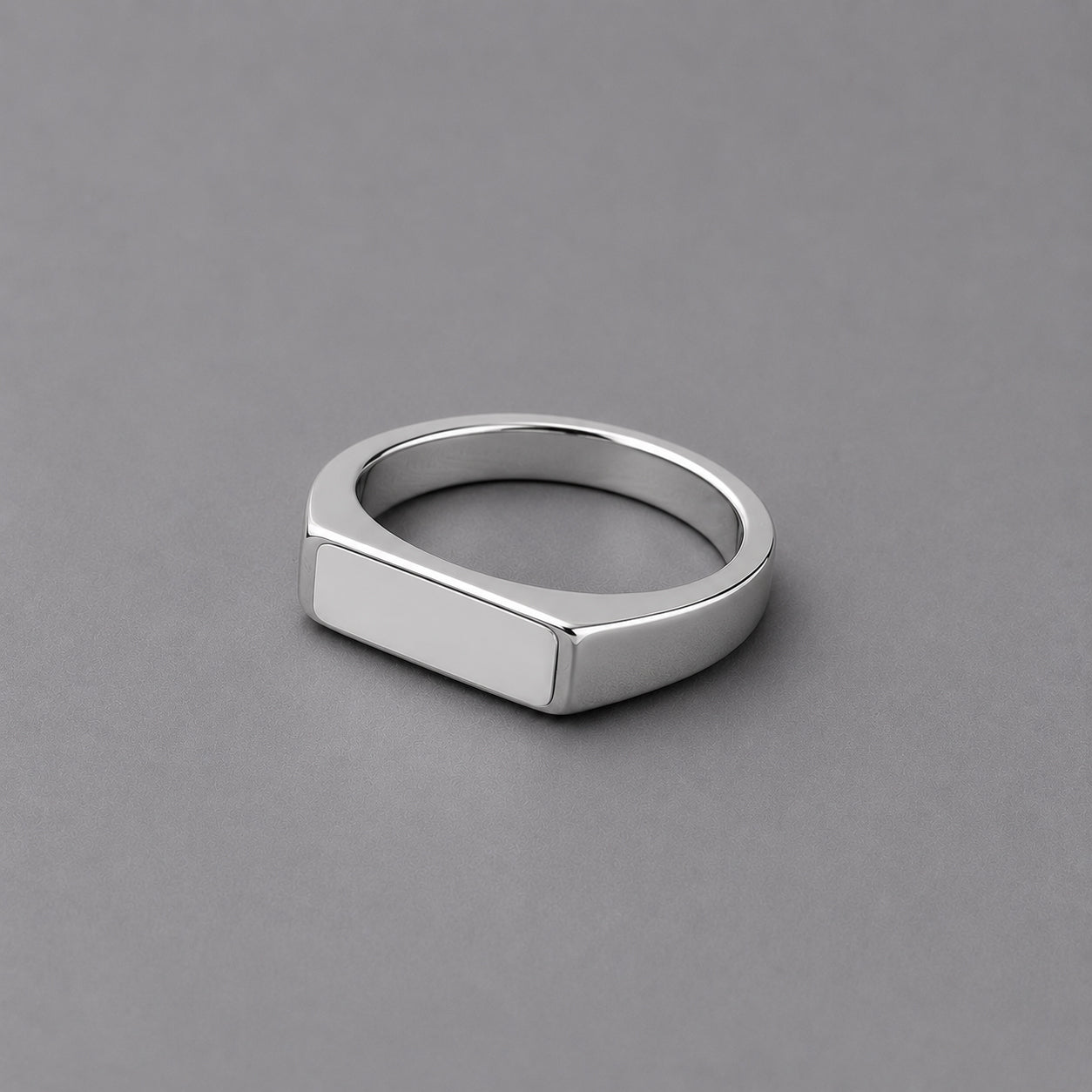 Silver ring on a grey background