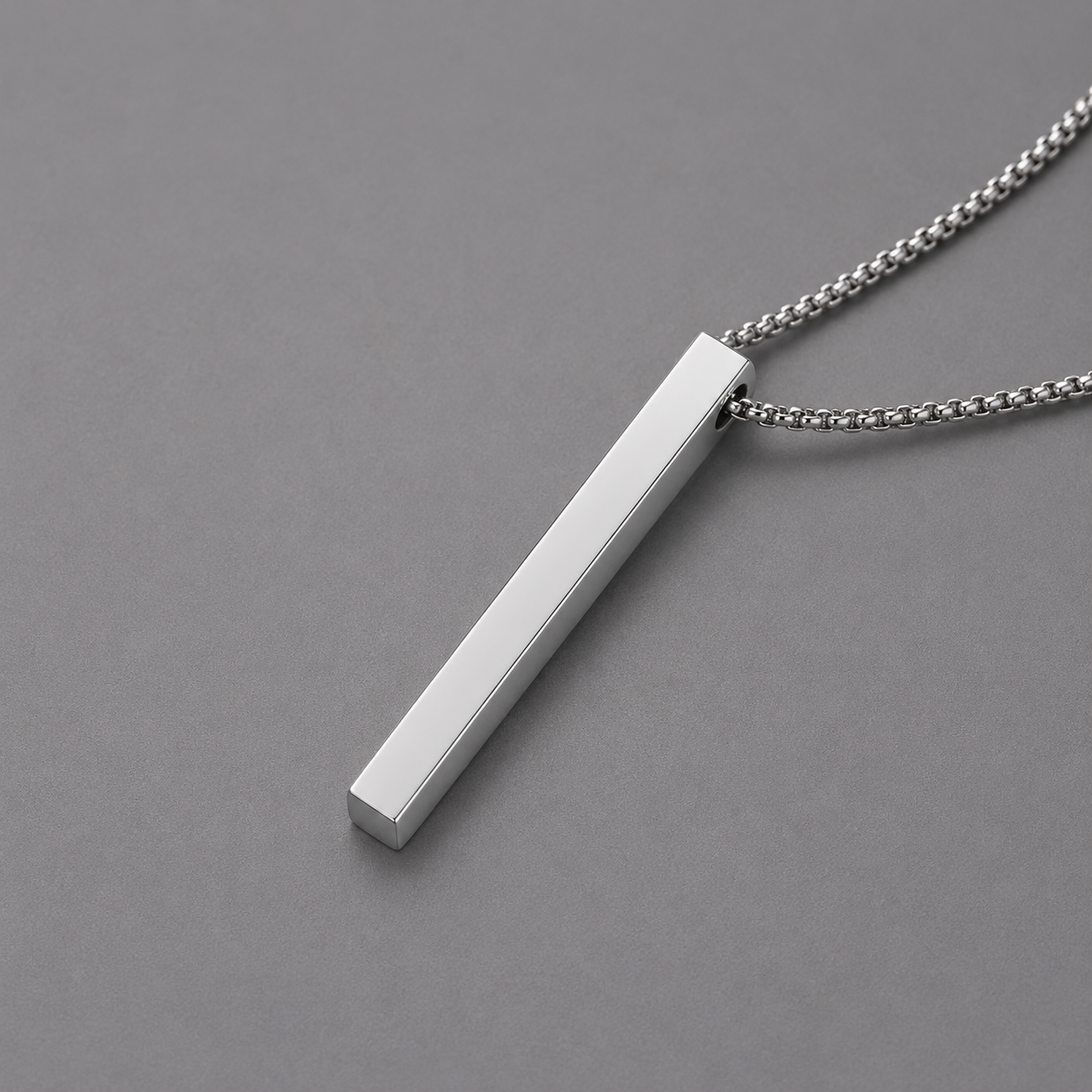 Silver bar necklace on a grey background